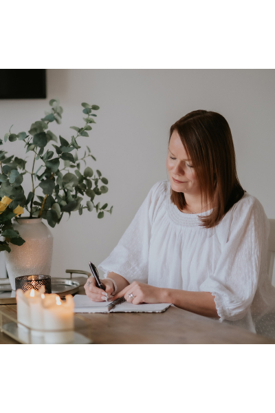 Marie-claire writing at a desk